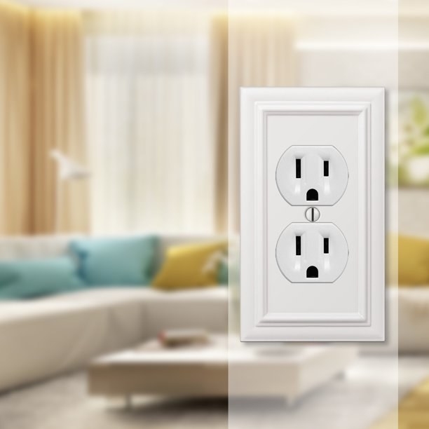 White outlet cover image on top of a blurred image of a living room.