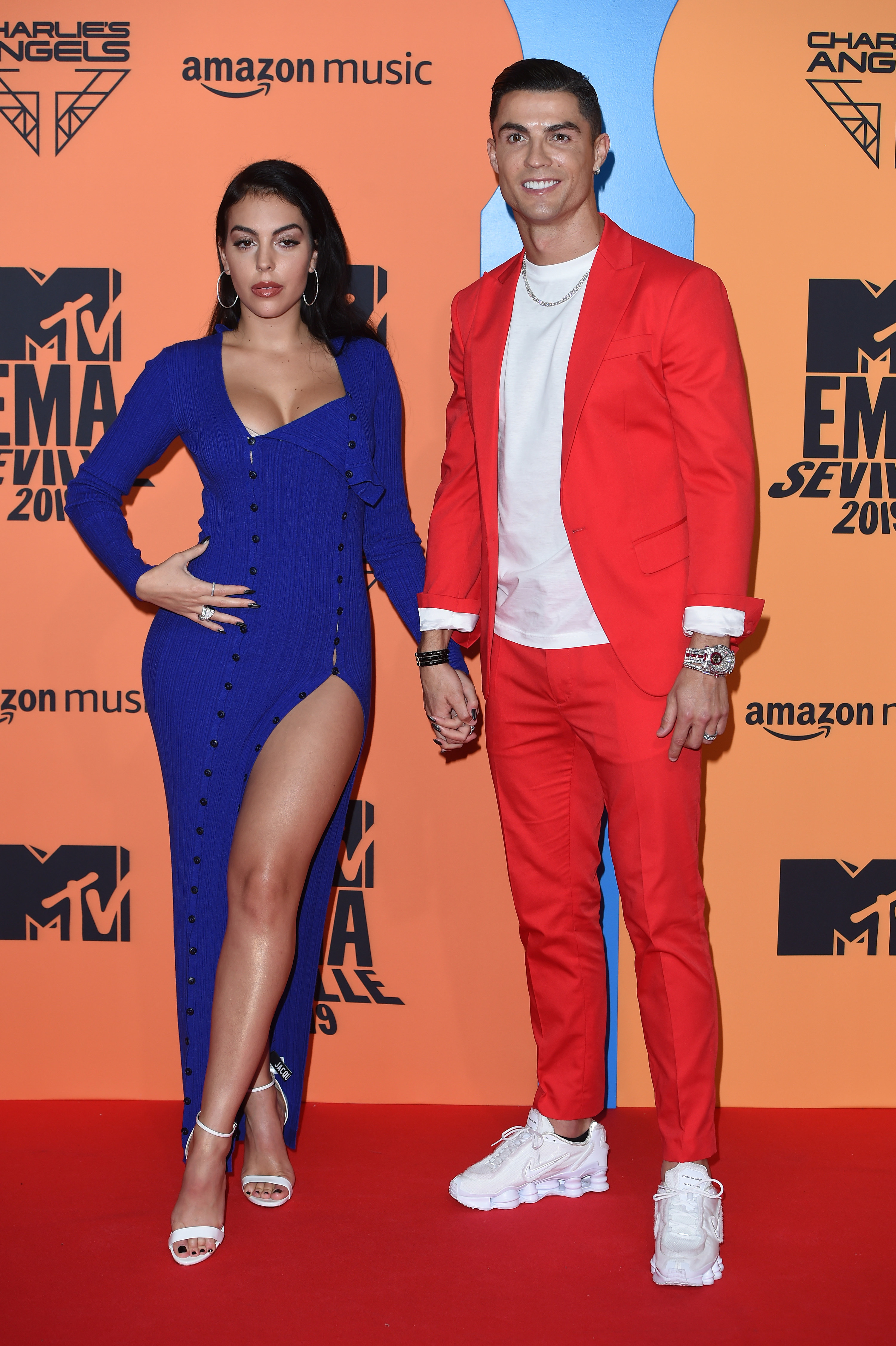 Georgina Rodriguez and Cristiano Ronaldo holding hands on the red carpet