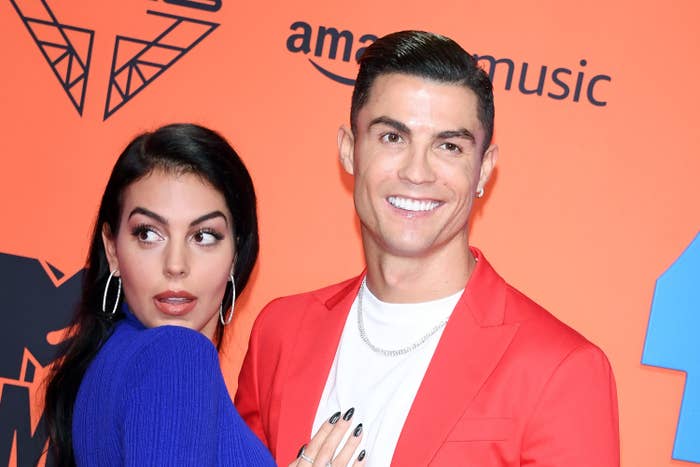 Georgina Rodriguez touching Cristiano Ronaldo&#x27;s chest on the red carpet