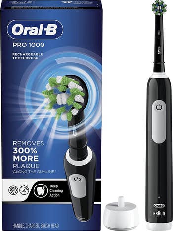 the black toothbrush and its rechargeable base