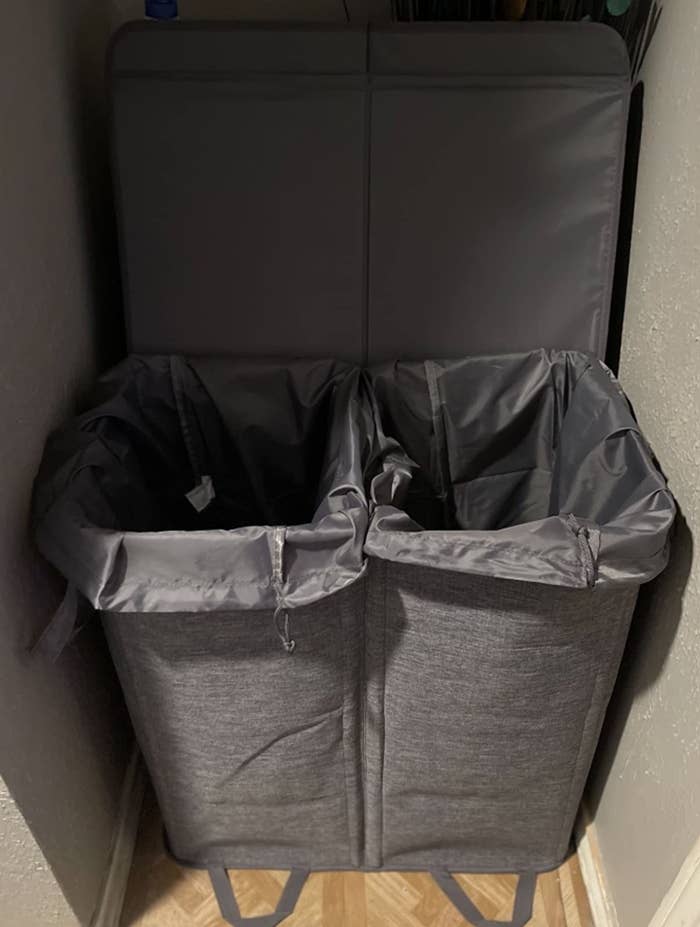 image of a gray dual hamper in a reviewer&#x27;s closet