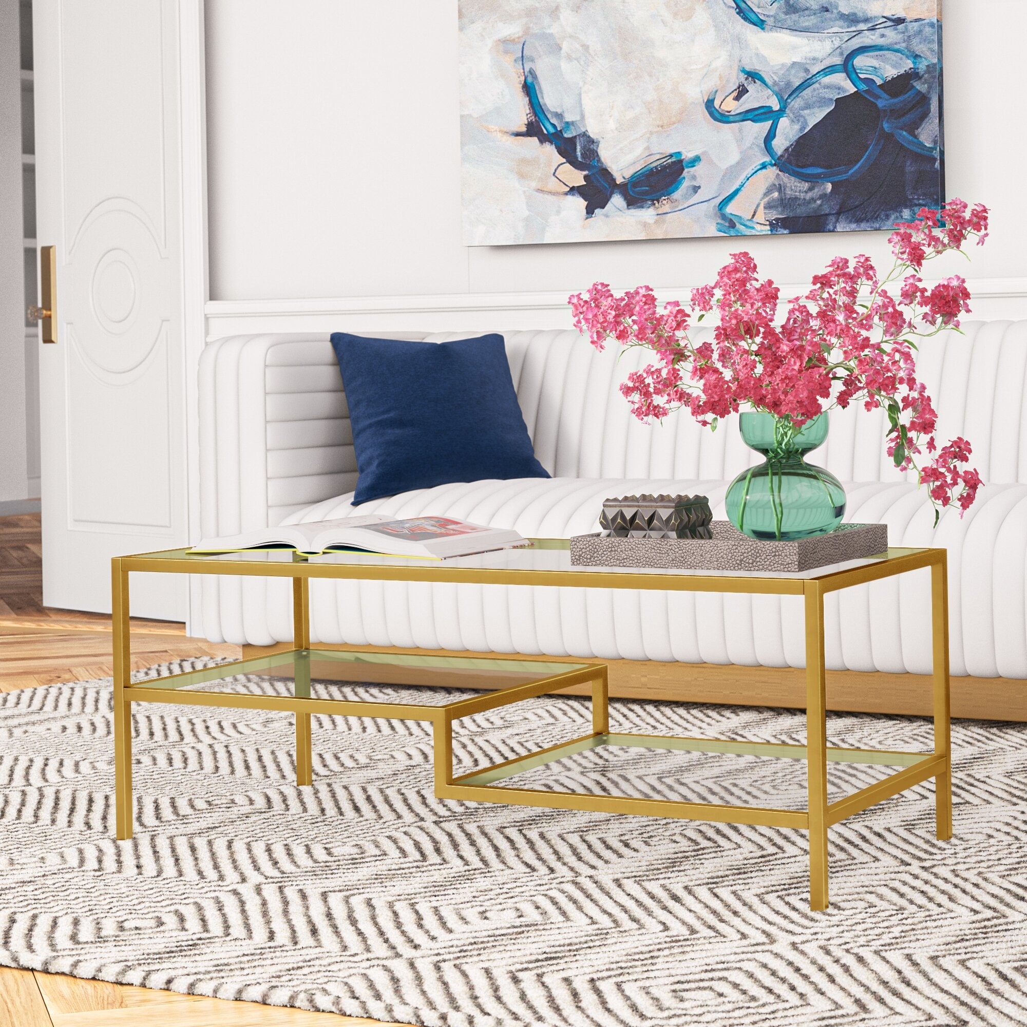 gold tone sculptural coffee table in living room