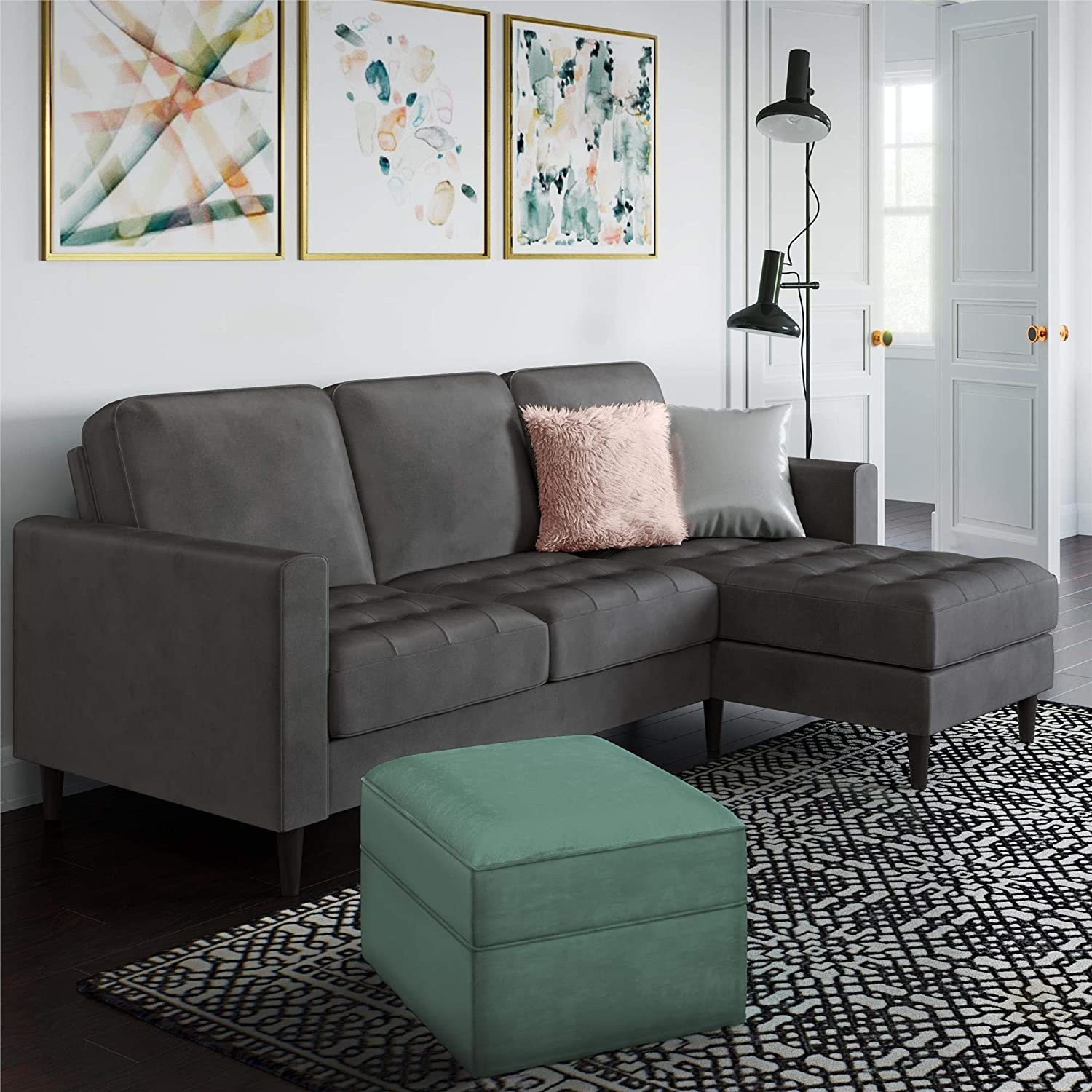 gray sectional with tufted seat cushions and chaise on right