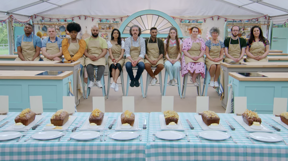 The contestants sitting behind their technical challenge bakes