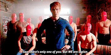 Archie saying &quot;see, there&#x27;s only one of you, but we are legion&quot; with the red circle behind him with masks on mostly shirtless