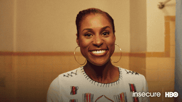 gif of Issa Rae looking at herself in the mirror saying you look great