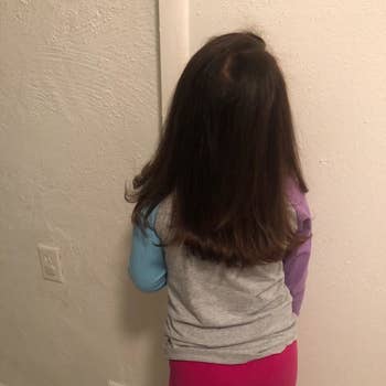 Reviewer's after photo of their child with hair straightened with the hot air brush