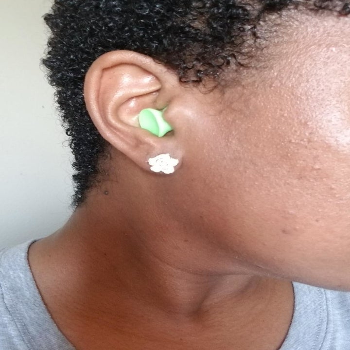 a different reviewer wearing the earplugs