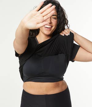 Model showing black T-shirt's built-in bra