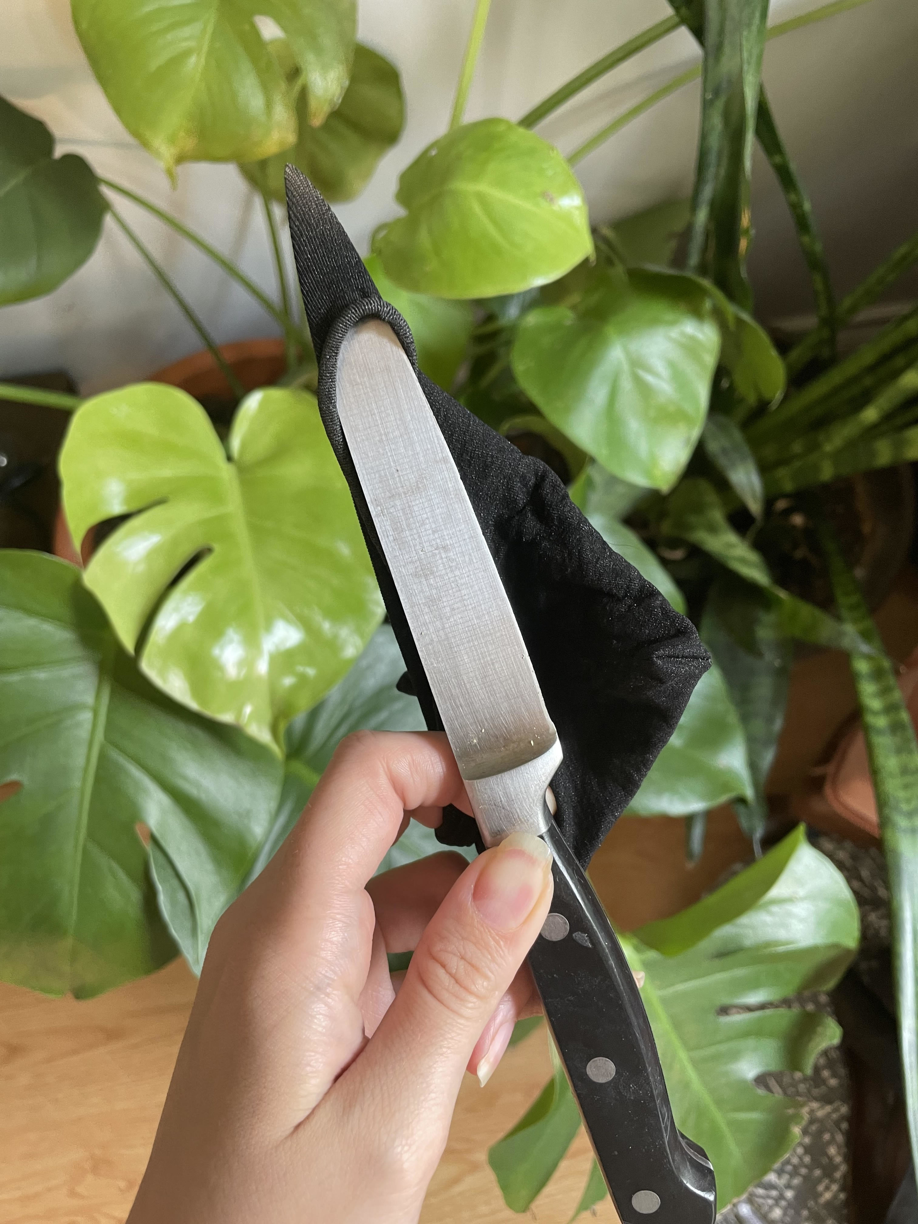 A person stabbing the stockings with a knife