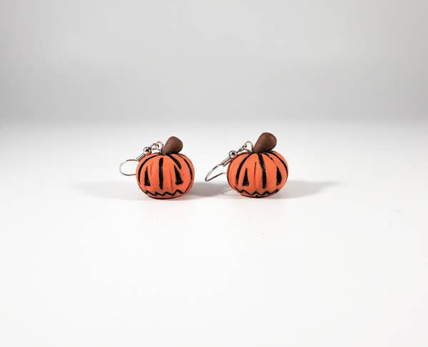 a pair of jack-o-lantern earrings