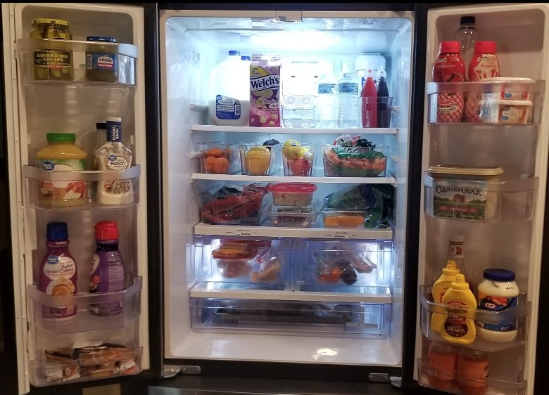 Open refrigerator with food storage system
