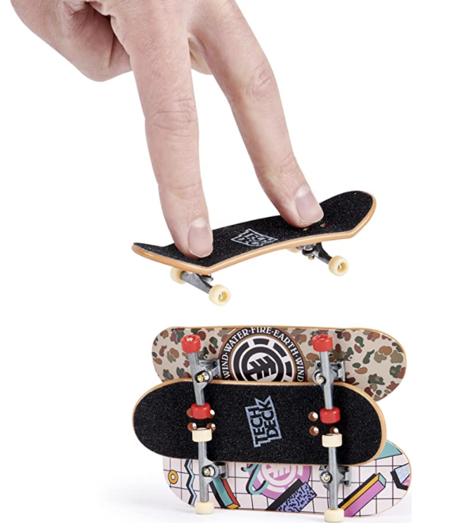 someone with their fingers on a Tech Deck and then two different patterned bottoms shown
