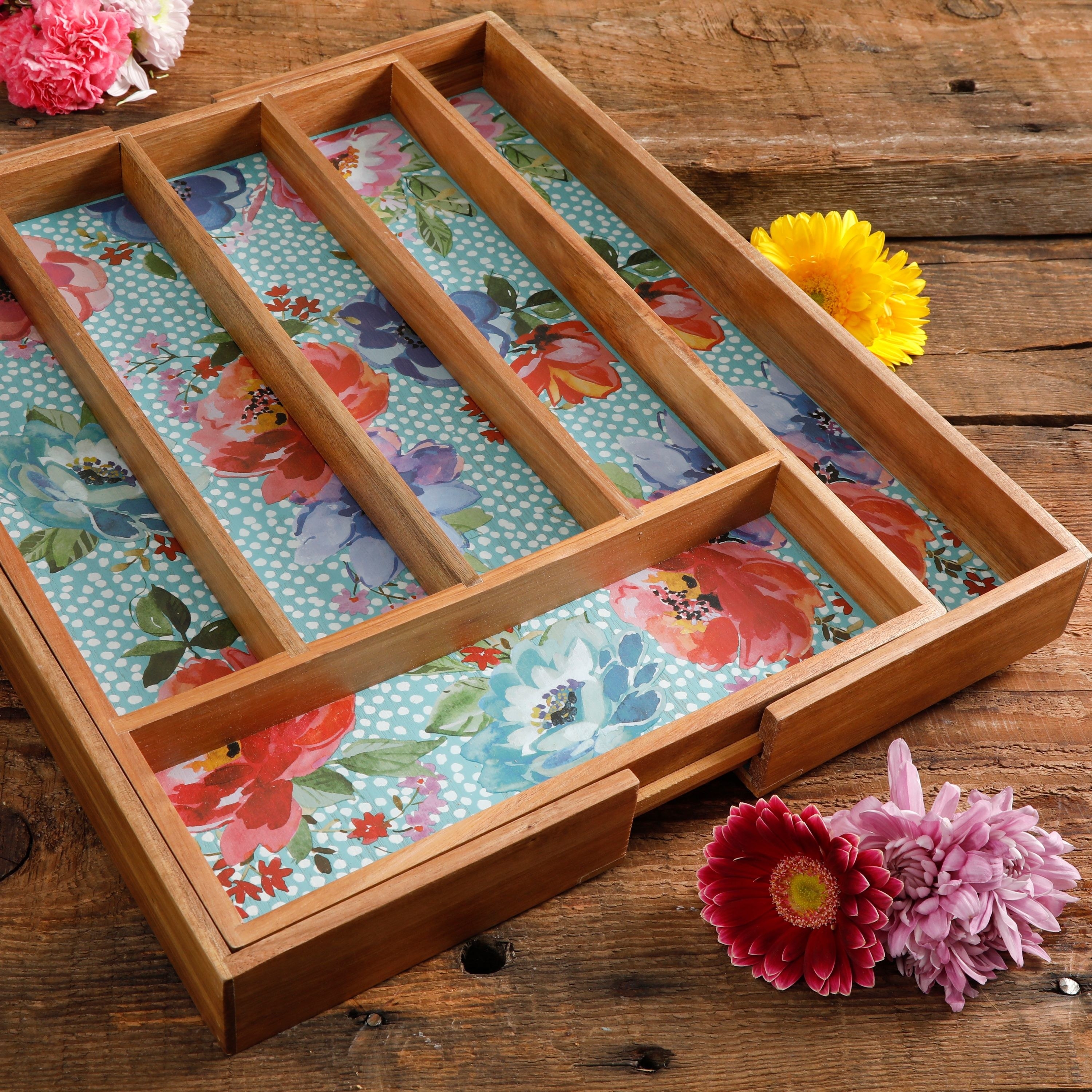 The wooden utensil holder with a floral design