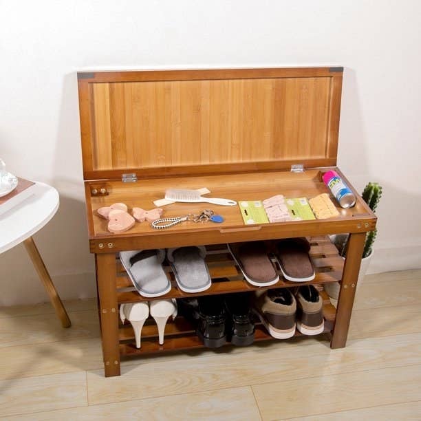 The wooden storage bench with two shelves for shoes