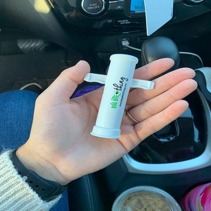 Reviewer holding the suction tool in their hands