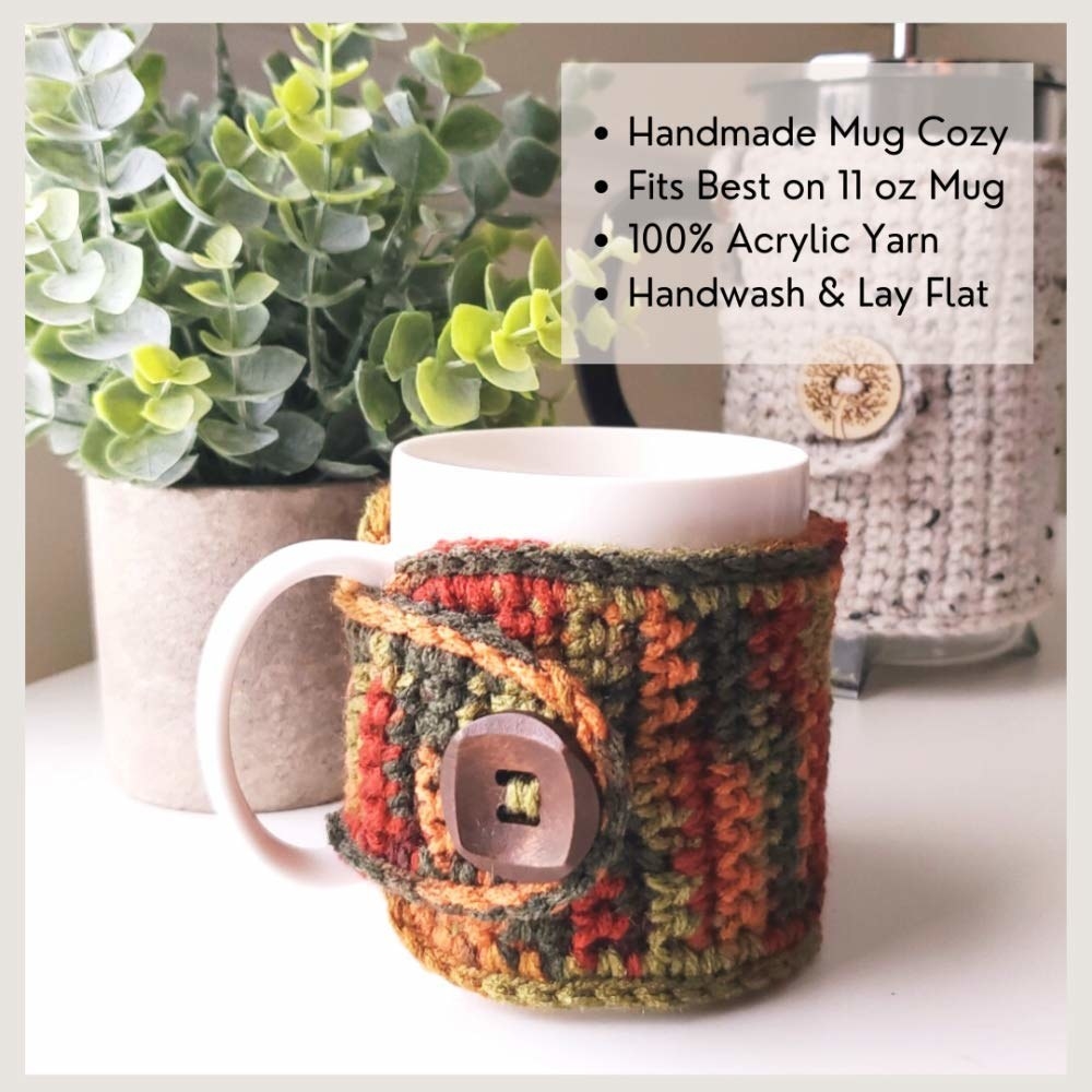 The knitted cozy made of red, green and orange yarn with a wooden button