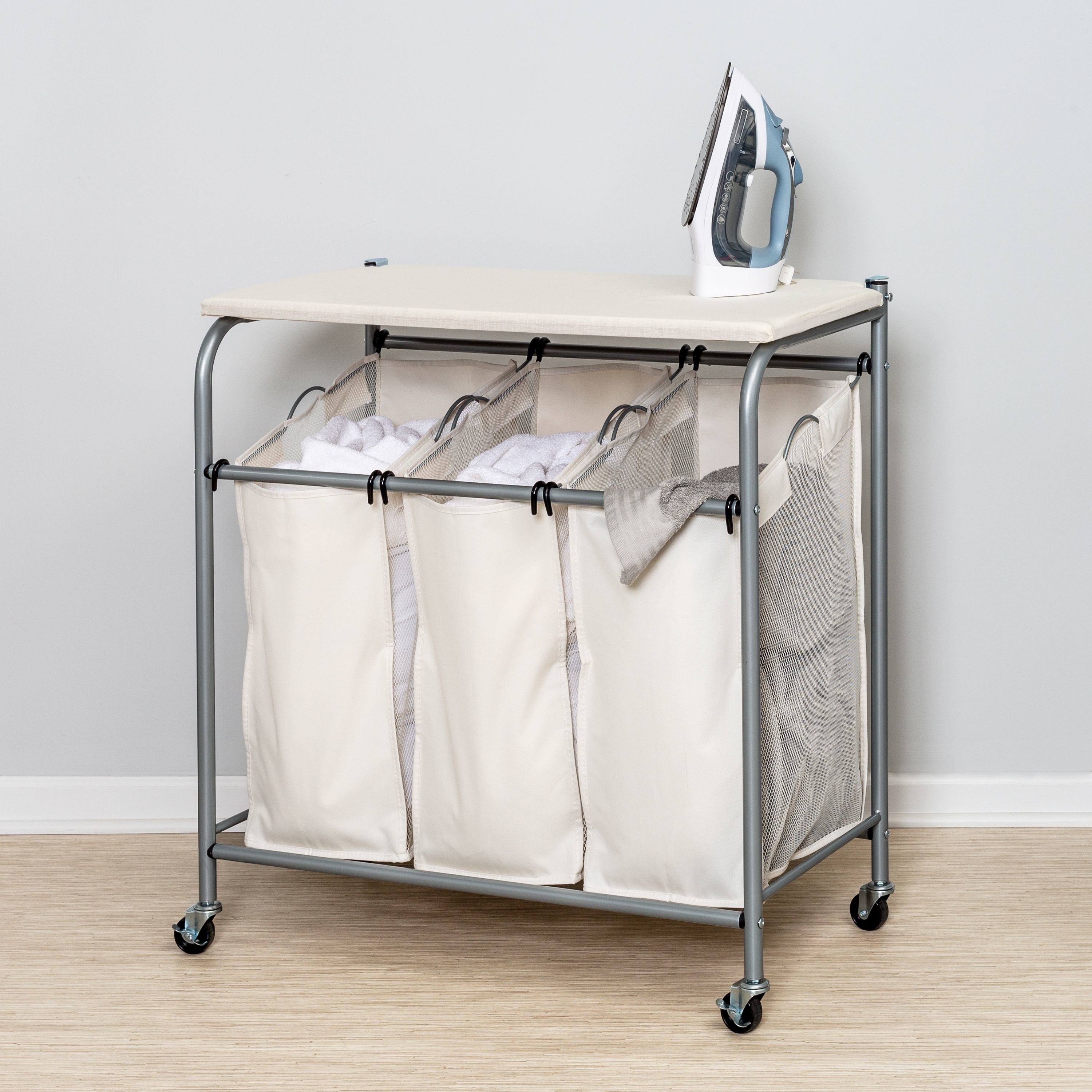 The triple basket laundry sorter on wheels with a top shelf for ironing