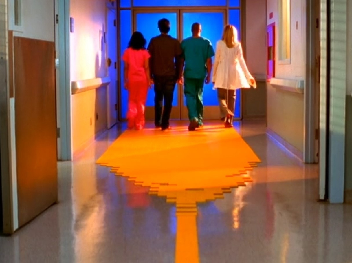 Hospital staff walks down yellow brick road