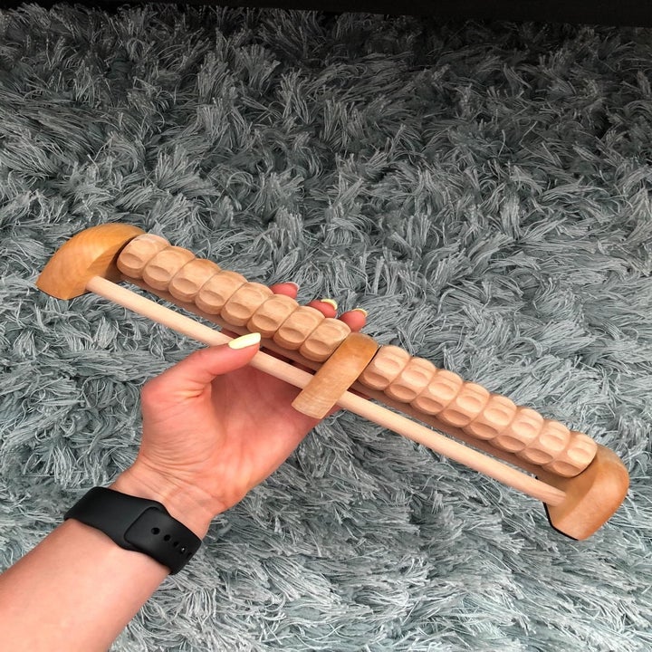 reviewer holding the massager