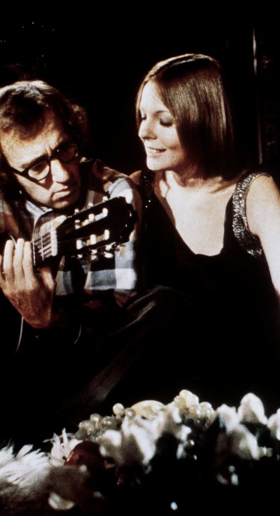 Linda listens to Sam play his guitar