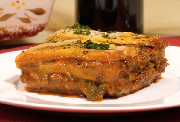 A square of lasagna made with Beyond Burger, cheese, and plantains