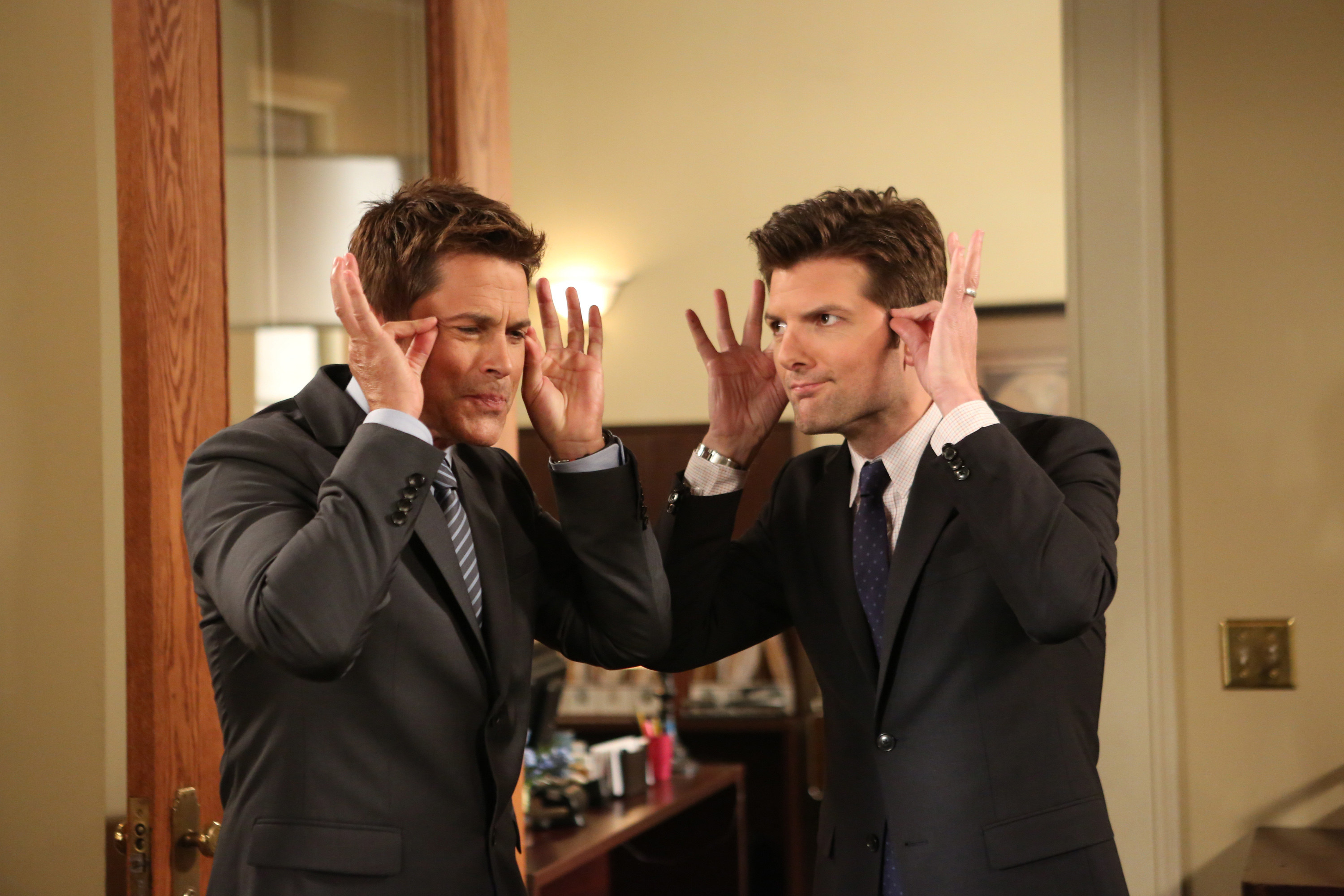 Chris and Ben putting on imaginary glasses