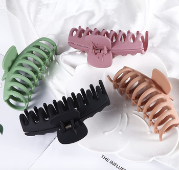 Claw clips in green, black, beige, and pink 