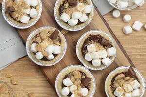 Overhead shot of S'mores Mini Pies on a wood board.