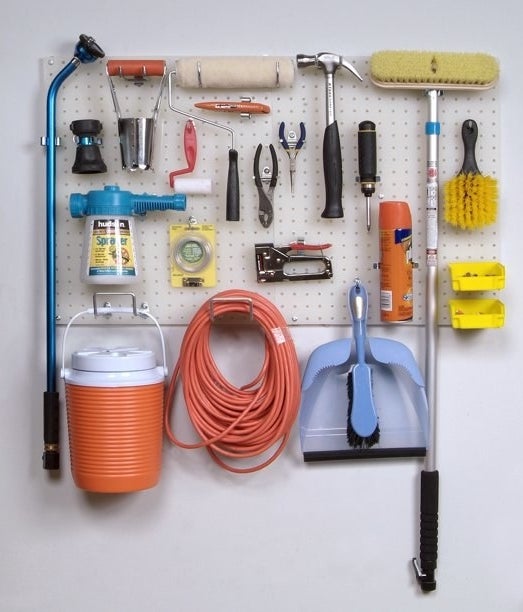 The pegboard holding many household tools