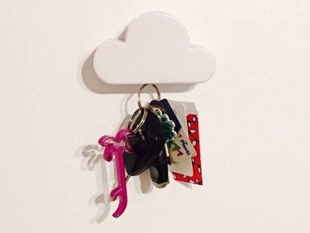The cloud on a wall with a keychain hanging from it