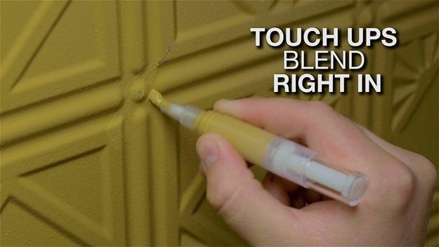 A hand using the pen to touch up green furniture with text &quot;touch ups blend right in&quot;