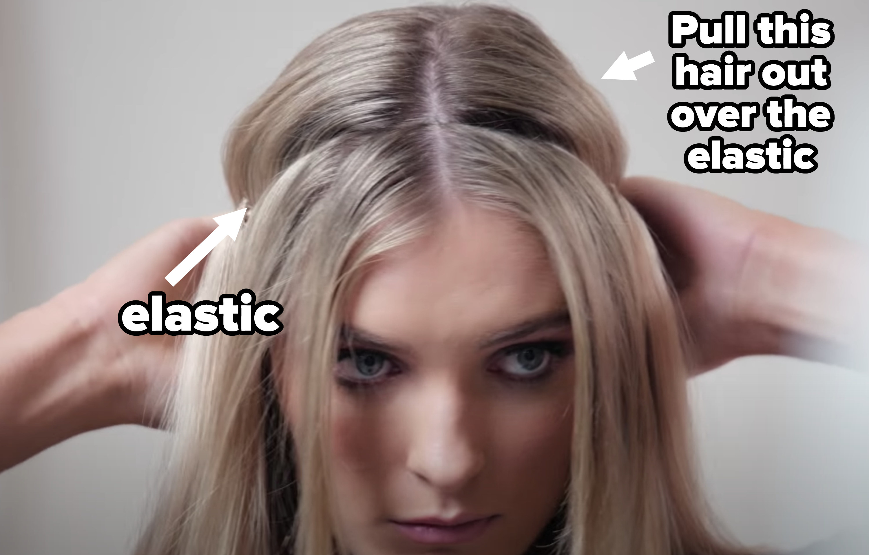 Woman putting on halo extensions with the elastic pointed out and an arrow showing the hair to pull out over the elastic