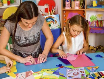 Adult and kid models moving connected origami kit