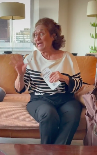 grandma sheila holding a package of mini pens