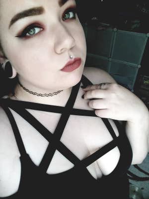 close up of reviewer wearing the pentagram dress in size XXL