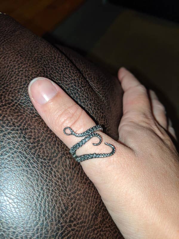 reviewer wearing kraken ring on thumb