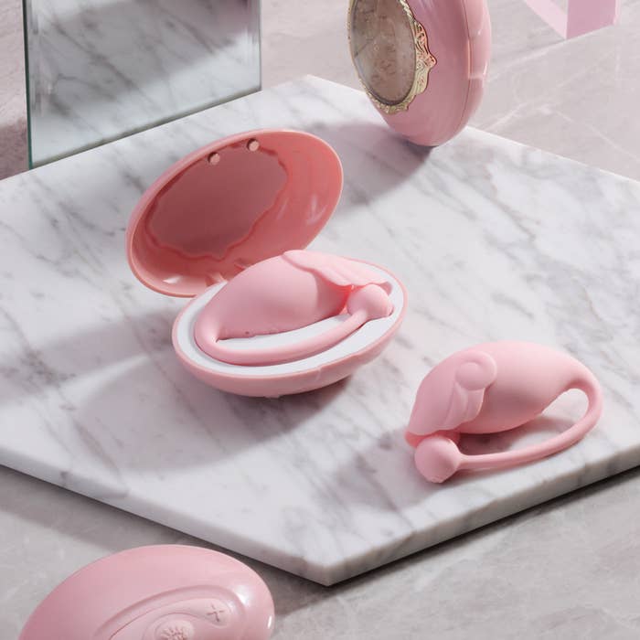 Pink charging case with pink egg-shaped vibrator