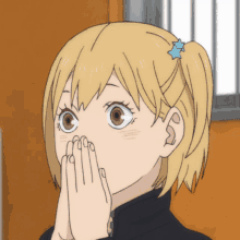 Yachi with her hands over her mouth blinking