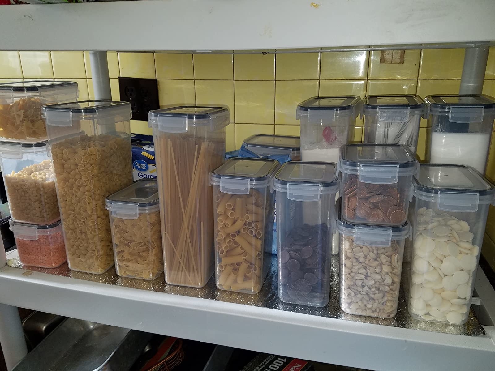 Reviewer photo of the plastic set full of various amounts of pantry foods