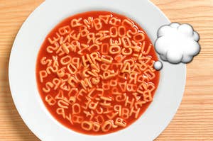 alphabet soup with a thinking cloud emoji next to it