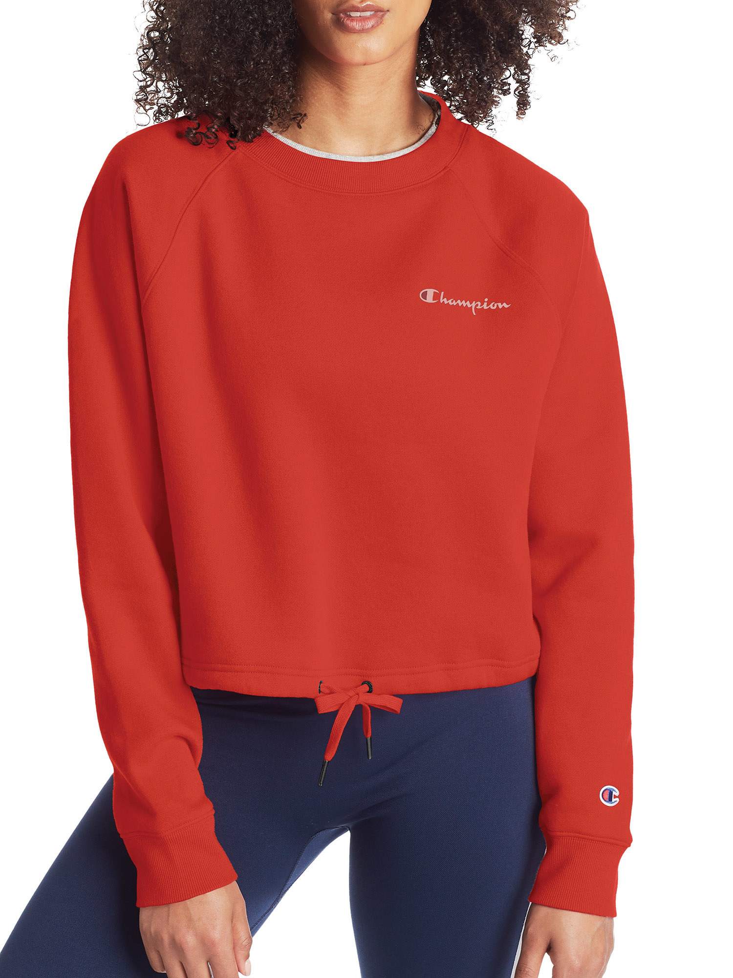 Model wearing the hearty red Champion fleece cropped sweatshirt