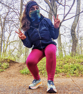 Reviewer in navy blue rain jacket