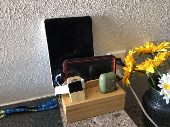 bamboo charging station powering up tablet, smartphone, Apple Watch and AirPods