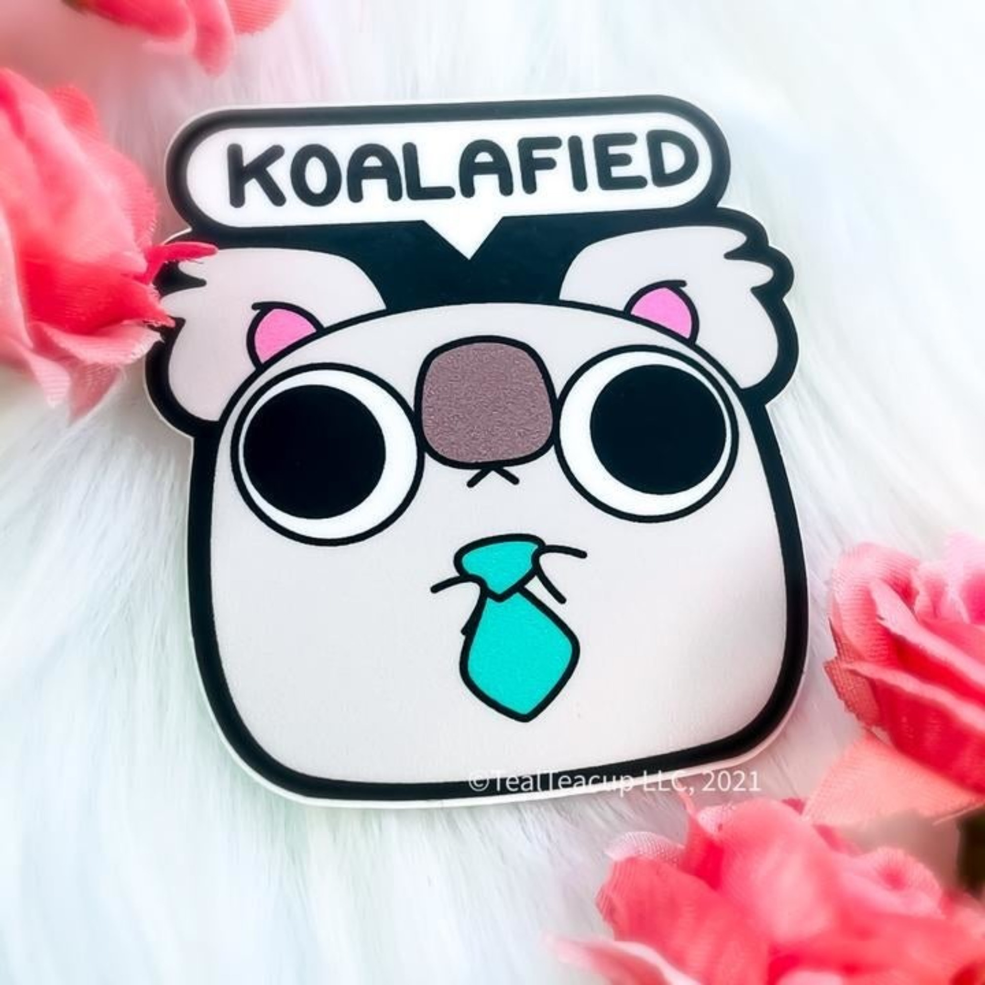 chonky koala wearing a tie with the text &quot;koalaified&quot;
