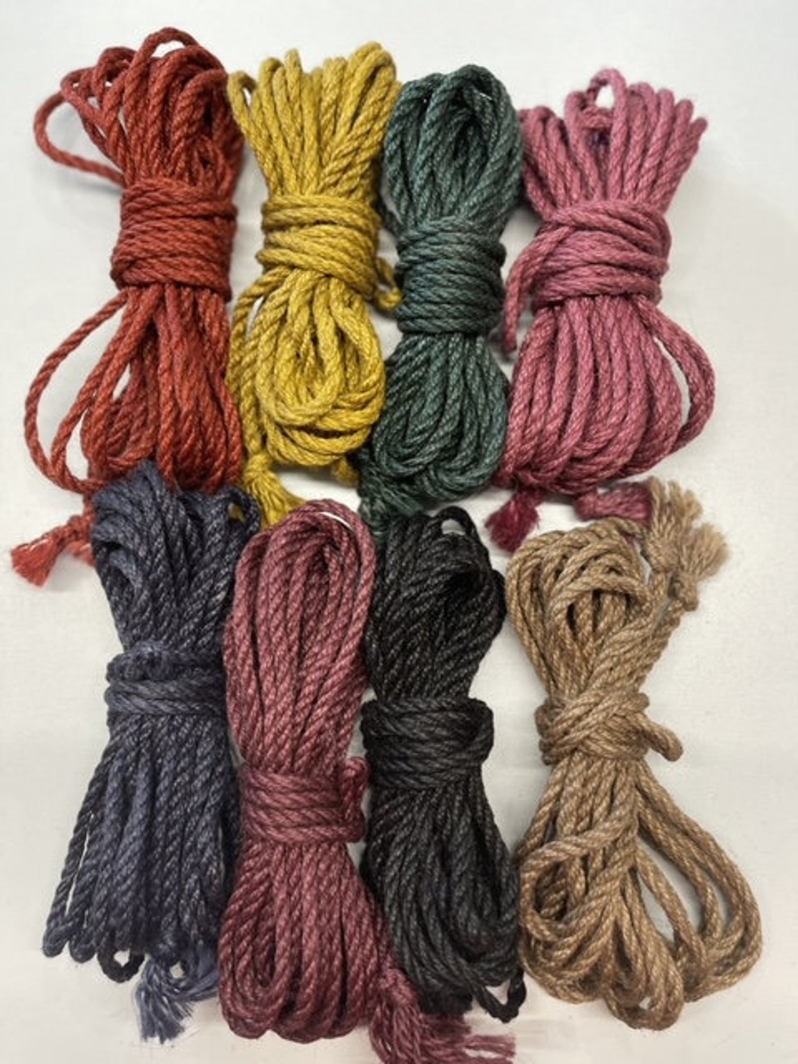 Shibari rope bundles in assorted colors