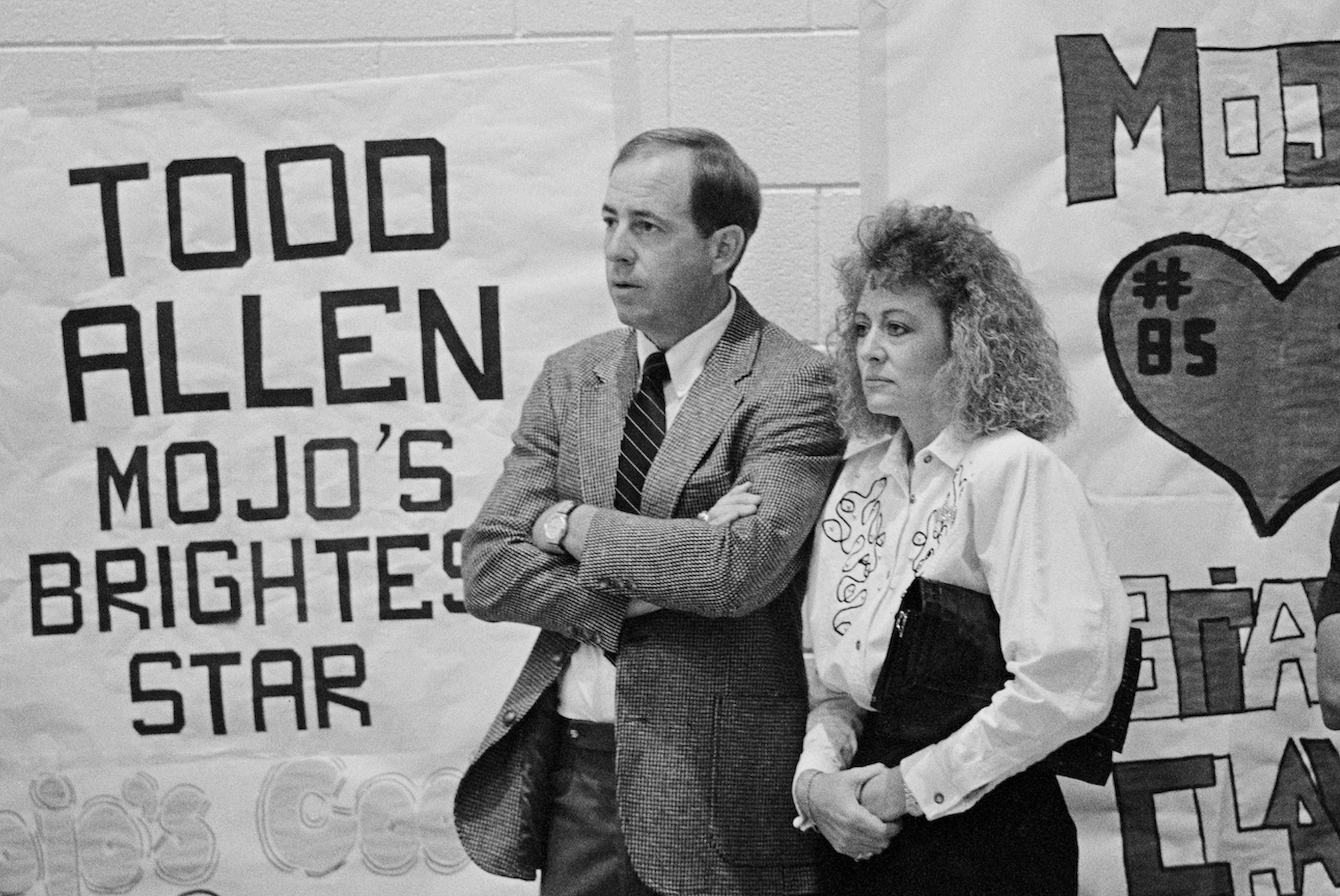 A man and a woman stand next to lettering: "Todd Allen Mojo's Brightest Star"