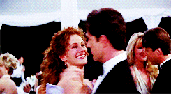 Gif from My Best Friends Wedding of two main characters dancing together