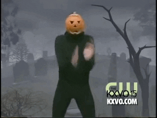 Person with pumpkin head dancing