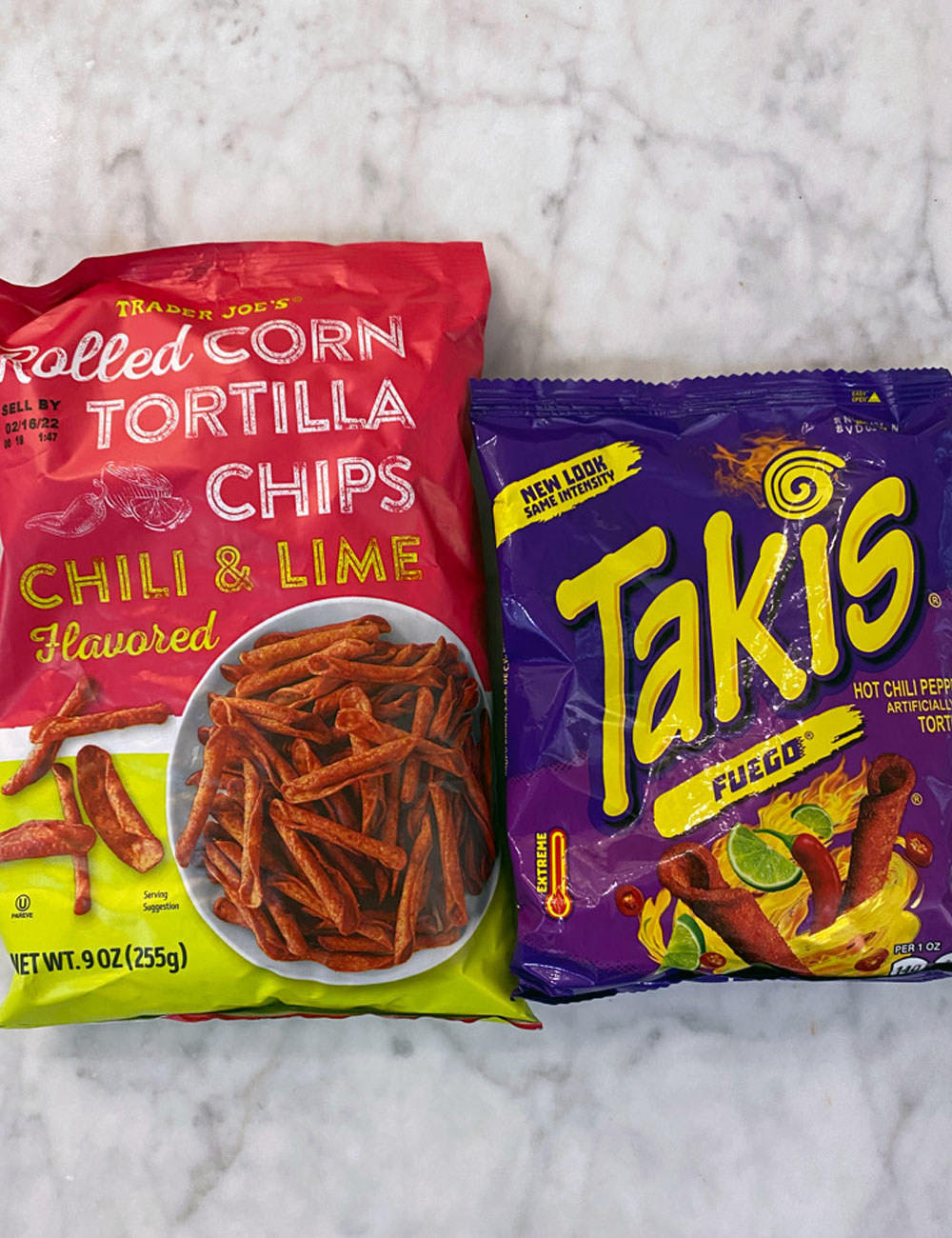 Rolled Corn Chili Lime Tortilla Chips and Takis in bags